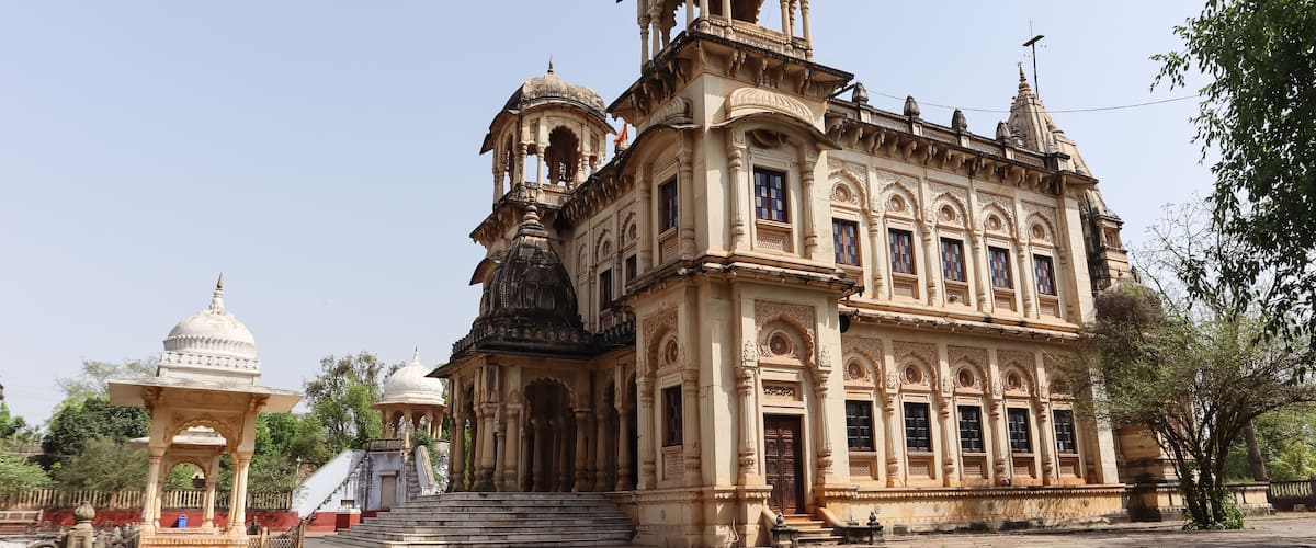 A historic building with ornate architecture, including domes and intricate carvings.