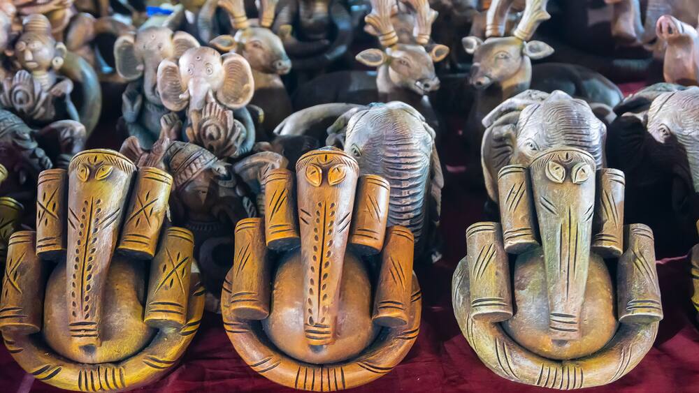 Colorful Lord Ganesha, Terracotta dolls displayed, made in Krishnanagar, Nadia, West Bengal, for sale in Handicraft Fair in Kolkata. Biggest handicraft fair in Asia.