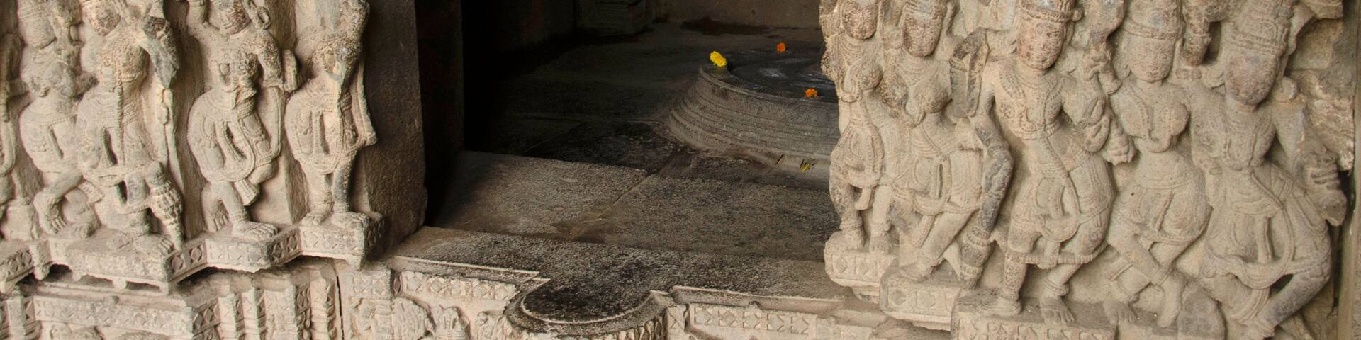 Carved wall outside the sanctum of the Baleshwar temple, one of the five rock temples inside Bahadurgad, Pedgaon, Taluka Shrigonda, Maharashtra, India