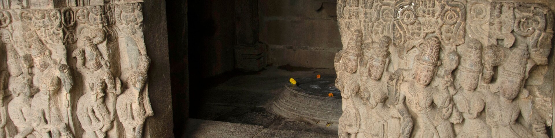 Carved wall outside the sanctum of the Baleshwar temple, one of the five rock temples inside Bahadurgad, Pedgaon, Taluka Shrigonda, Maharashtra, India