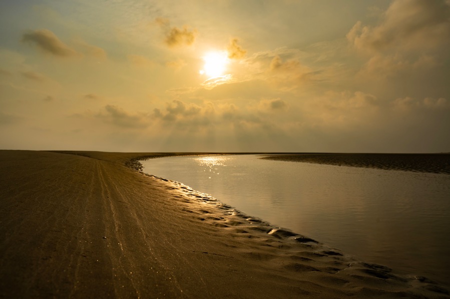 Landscape of bakkhali sea beach. Sea Beach of Bakkhali, West Bengal, India. Sunrise from Bakkhali sea beach. Land view after water run off at sea beach. photo taken at Bakkhali