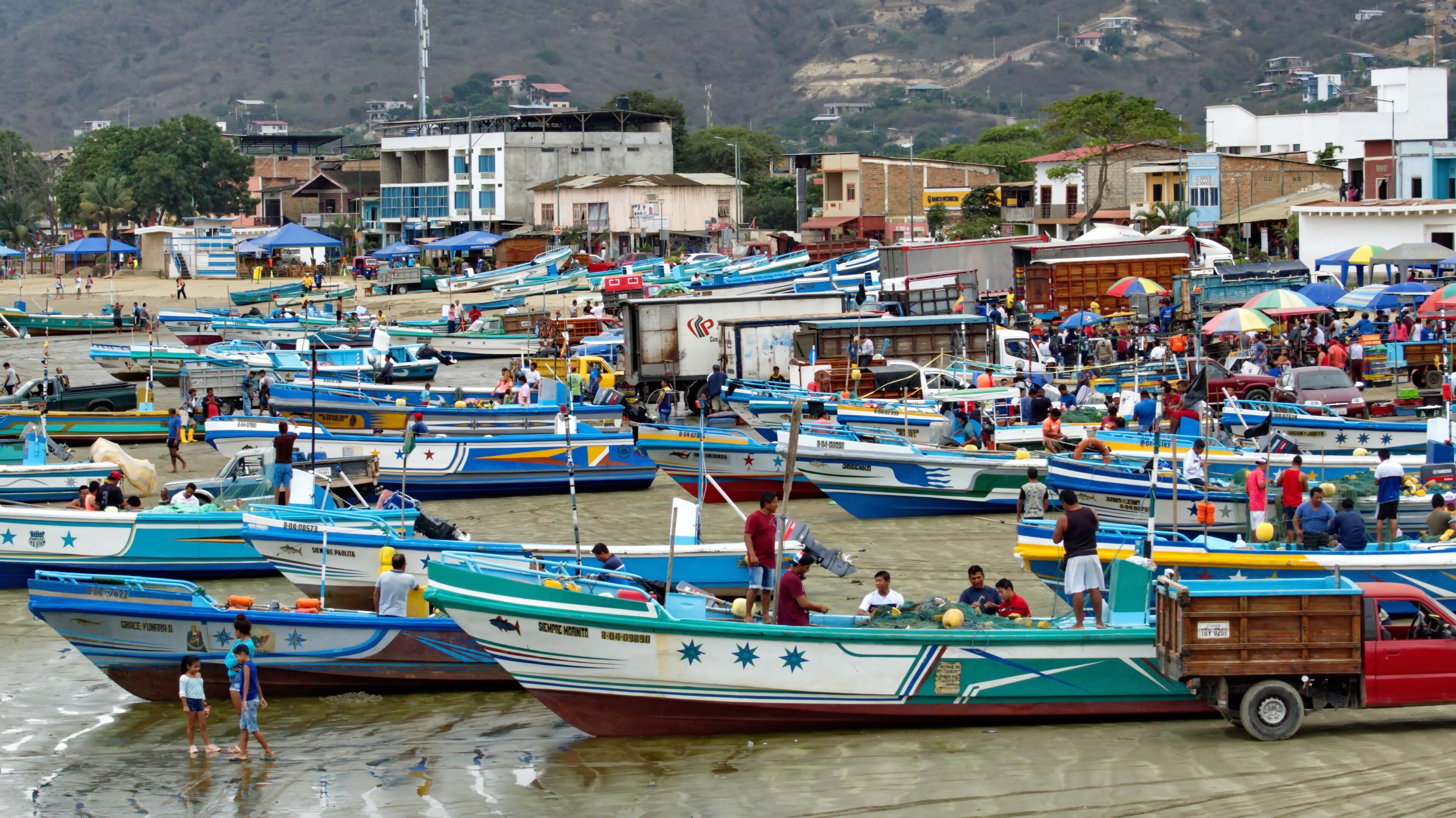 Fishing fleet on the beach in the harbor in Puerto Lopez, Ecuador