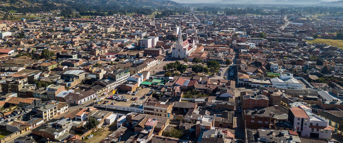 A densely populated urban area with a prominent church and surrounding residential buildings.