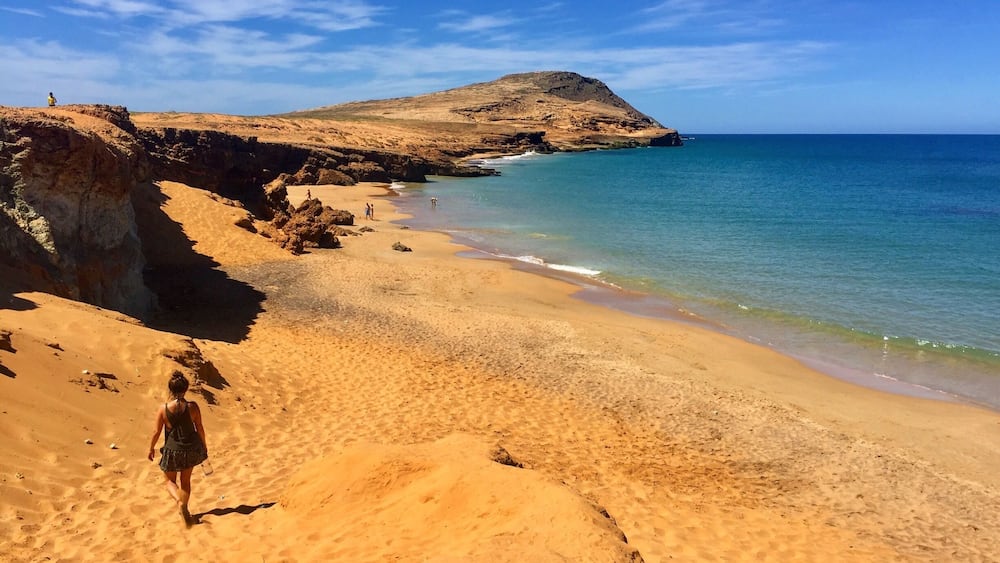 For more on Colombia travel follow us at www.instagram.com/globesurfing
DESTINATION: CABO DE LA VELA, Colombia - A day of taxi, bus and jeep hopping will land you in this dusty fishing village sitting on the edge of South Americas northern most point. Where scorched orange desert meets the azure blue of the Caribbean ocean. Cabo village feels extremely remote, surrounded by baron landscape. From here there is the option to shell out a little extra to visit the giant rolling sand dunes of Punta Gallinas. Pilon de Azucar provides a 360 degree lookout point and this incredible beach.
HOW TO GET THERE: From Santa Marta take a bus from the Terminal De Transporte to Riohacha (3hr). A taxi from Riohacha to Uribia (1hr). Finally jump in a colectivo to Cabo Del La Vela (1hr bumpy 4x4 ride). Rough cost 55,000COP.
To reach Pilon de Azucar (featured) just grab a cheap moto taxi from Cabo town.
WHERE TO STAY: Riohacha - To break up the journey check into Hammocks Hostel.
Cabo Del La Vela - Hammocks line the beach. The cheapest are where the colectivos drop you off. 10,000COP/£2.50 for a hammock. 25,000COP/£6 for a dorm bed.