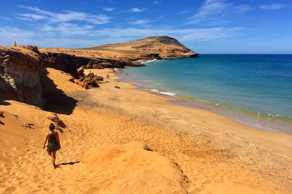 For more on Colombia travel follow us at www.instagram.com/globesurfing
DESTINATION: CABO DE LA VELA, Colombia - A day of taxi, bus and jeep hopping will land you in this dusty fishing village sitting on the edge of South Americas northern most point. Where scorched orange desert meets the azure blue of the Caribbean ocean. Cabo village feels extremely remote, surrounded by baron landscape. From here there is the option to shell out a little extra to visit the giant rolling sand dunes of Punta Gallinas. Pilon de Azucar provides a 360 degree lookout point and this incredible beach.
HOW TO GET THERE: From Santa Marta take a bus from the Terminal De Transporte to Riohacha (3hr). A taxi from Riohacha to Uribia (1hr). Finally jump in a colectivo to Cabo Del La Vela (1hr bumpy 4x4 ride). Rough cost 55,000COP.
To reach Pilon de Azucar (featured) just grab a cheap moto taxi from Cabo town.
WHERE TO STAY: Riohacha - To break up the journey check into Hammocks Hostel.
Cabo Del La Vela - Hammocks line the beach. The cheapest are where the colectivos drop you off. 10,000COP/ÂŁ2.50 for a hammock. 25,000COP/ÂŁ6 for a dorm bed.