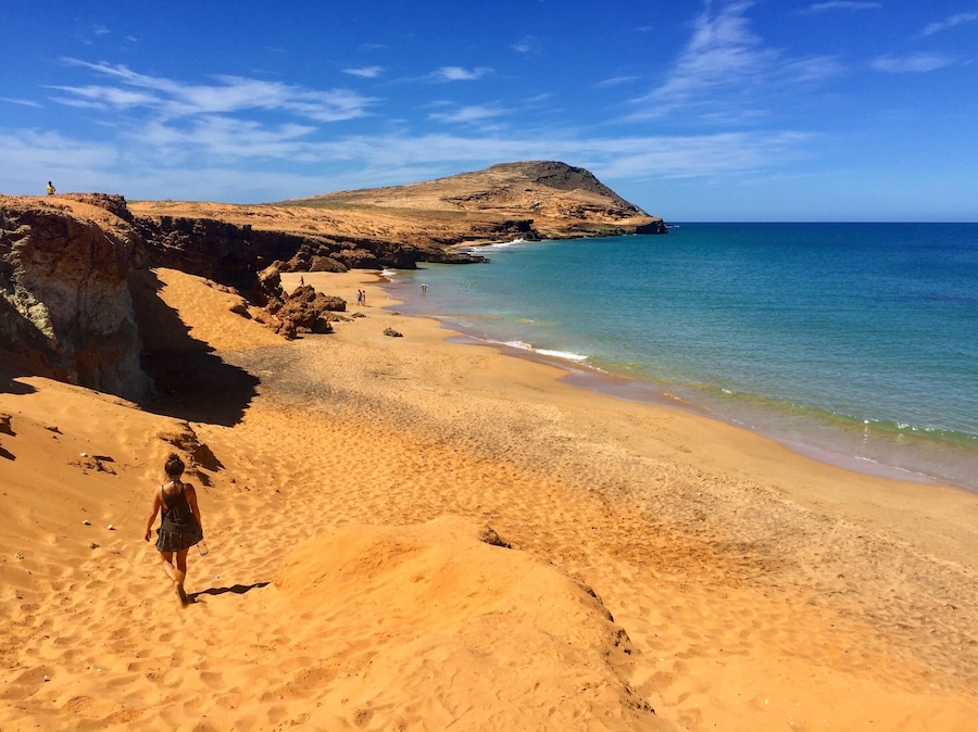 For more on Colombia travel follow us at www.instagram.com/globesurfing
DESTINATION: CABO DE LA VELA, Colombia - A day of taxi, bus and jeep hopping will land you in this dusty fishing village sitting on the edge of South Americas northern most point. Where scorched orange desert meets the azure blue of the Caribbean ocean. Cabo village feels extremely remote, surrounded by baron landscape. From here there is the option to shell out a little extra to visit the giant rolling sand dunes of Punta Gallinas. Pilon de Azucar provides a 360 degree lookout point and this incredible beach.
HOW TO GET THERE: From Santa Marta take a bus from the Terminal De Transporte to Riohacha (3hr). A taxi from Riohacha to Uribia (1hr). Finally jump in a colectivo to Cabo Del La Vela (1hr bumpy 4x4 ride). Rough cost 55,000COP.
To reach Pilon de Azucar (featured) just grab a cheap moto taxi from Cabo town.
WHERE TO STAY: Riohacha - To break up the journey check into Hammocks Hostel.
Cabo Del La Vela - Hammocks line the beach. The cheapest are where the colectivos drop you off. 10,000COP/£2.50 for a hammock. 25,000COP/£6 for a dorm bed.