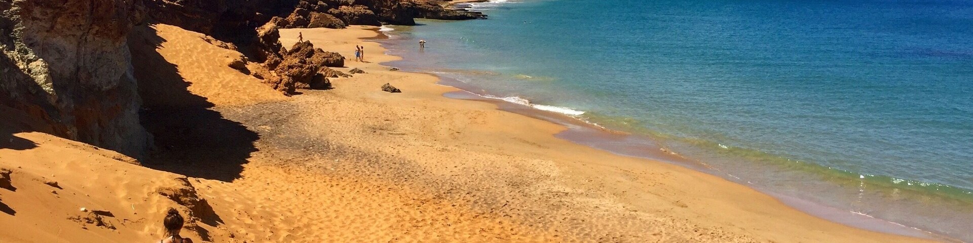 For more on Colombia travel follow us at www.instagram.com/globesurfing
DESTINATION: CABO DE LA VELA, Colombia - A day of taxi, bus and jeep hopping will land you in this dusty fishing village sitting on the edge of South Americas northern most point. Where scorched orange desert meets the azure blue of the Caribbean ocean. Cabo village feels extremely remote, surrounded by baron landscape. From here there is the option to shell out a little extra to visit the giant rolling sand dunes of Punta Gallinas. Pilon de Azucar provides a 360 degree lookout point and this incredible beach.
HOW TO GET THERE: From Santa Marta take a bus from the Terminal De Transporte to Riohacha (3hr). A taxi from Riohacha to Uribia (1hr). Finally jump in a colectivo to Cabo Del La Vela (1hr bumpy 4x4 ride). Rough cost 55,000COP.
To reach Pilon de Azucar (featured) just grab a cheap moto taxi from Cabo town.
WHERE TO STAY: Riohacha - To break up the journey check into Hammocks Hostel.
Cabo Del La Vela - Hammocks line the beach. The cheapest are where the colectivos drop you off. 10,000COP/£2.50 for a hammock. 25,000COP/£6 for a dorm bed.
