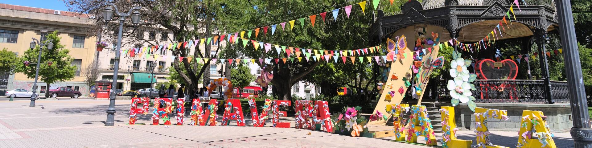 View of letters "Primavera Talca" (="spring Talca" in spanish) at the entrance of Plaza de Armas park in a small south american town (Talca, Chile)