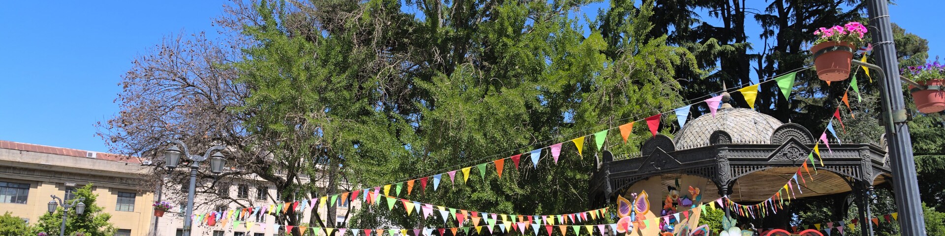 View of letters "Primavera Talca" (="spring Talca" in spanish) at the entrance of Plaza de Armas park in a small south american town (Talca, Chile)
