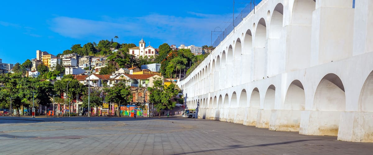 A white arched structure with a clear blue sky in the background.