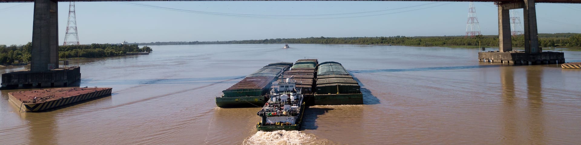 Long Arm Zarate Bridge, located in South America, Argentina, divides the province of Buenos Aires and Entre Rios. below this ship, cargo ships to Brazil and other destinations.