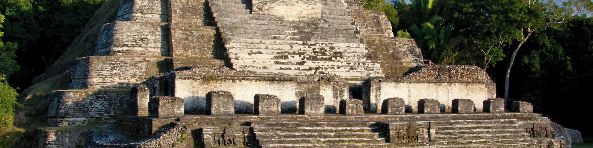 Altun Ha is a ruined Mayan city in northern Belize. The largest of the temple-pyramids on the site, the "Temple of the Masonry Alters", is 54 feet (16 m) high. A drawing of this structure is the logo of Belize's leading brand of beer, Belikin.