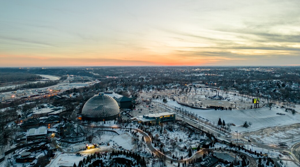 Vertical Aerial image of the Henry Doorly Zoo and Aquarium Omaha Nebraska Zoo Futuristic dome in the winter covered in snow at sunset
