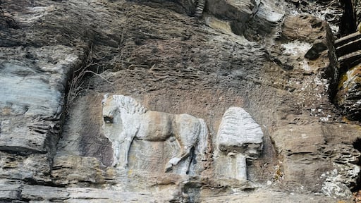 Prattsville, NY, USA - Dec 27, 2024. Uphill, short mountain hike to Pratt Rock. Mount Rushmore of upstate New York. Cliff stone carving for Zadock Pratt. Nearby dog and horse tombstone, valley view.