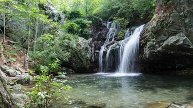 Summertime morning view of a waterfall in the Talladega National Forest near Ashville and Lineville, Alabama, USA