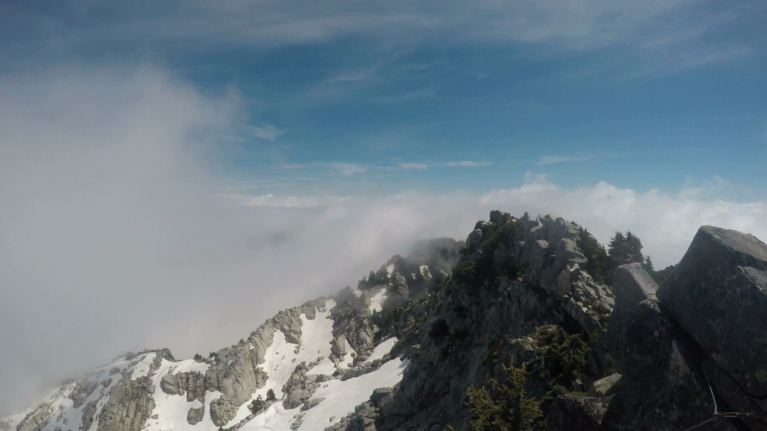 The clouds came sweeping in and out on the peak of Mount Pilchuck. It's not necessary to wait for a completely clear day to see view from Pilchuck. Seeing the peaks of the surrounding mountain poke through the clouds was great!