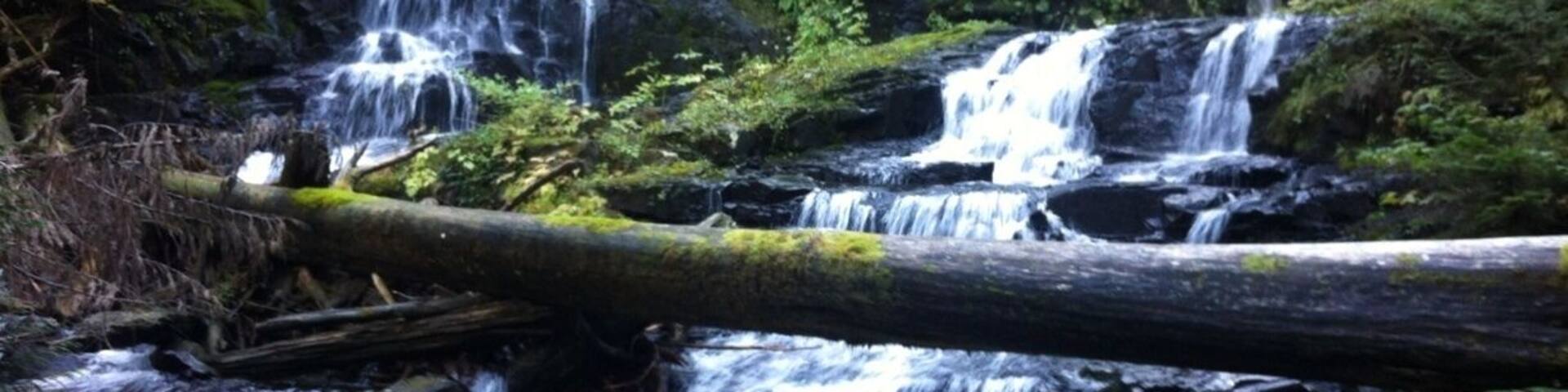 Lake twenty two trail off mountain loop hwy. Find these two waterfalls about 1.5 miles off trail on the left. Peaceful, quiet and serene. Continue back on trail for another mile or so to the lake.