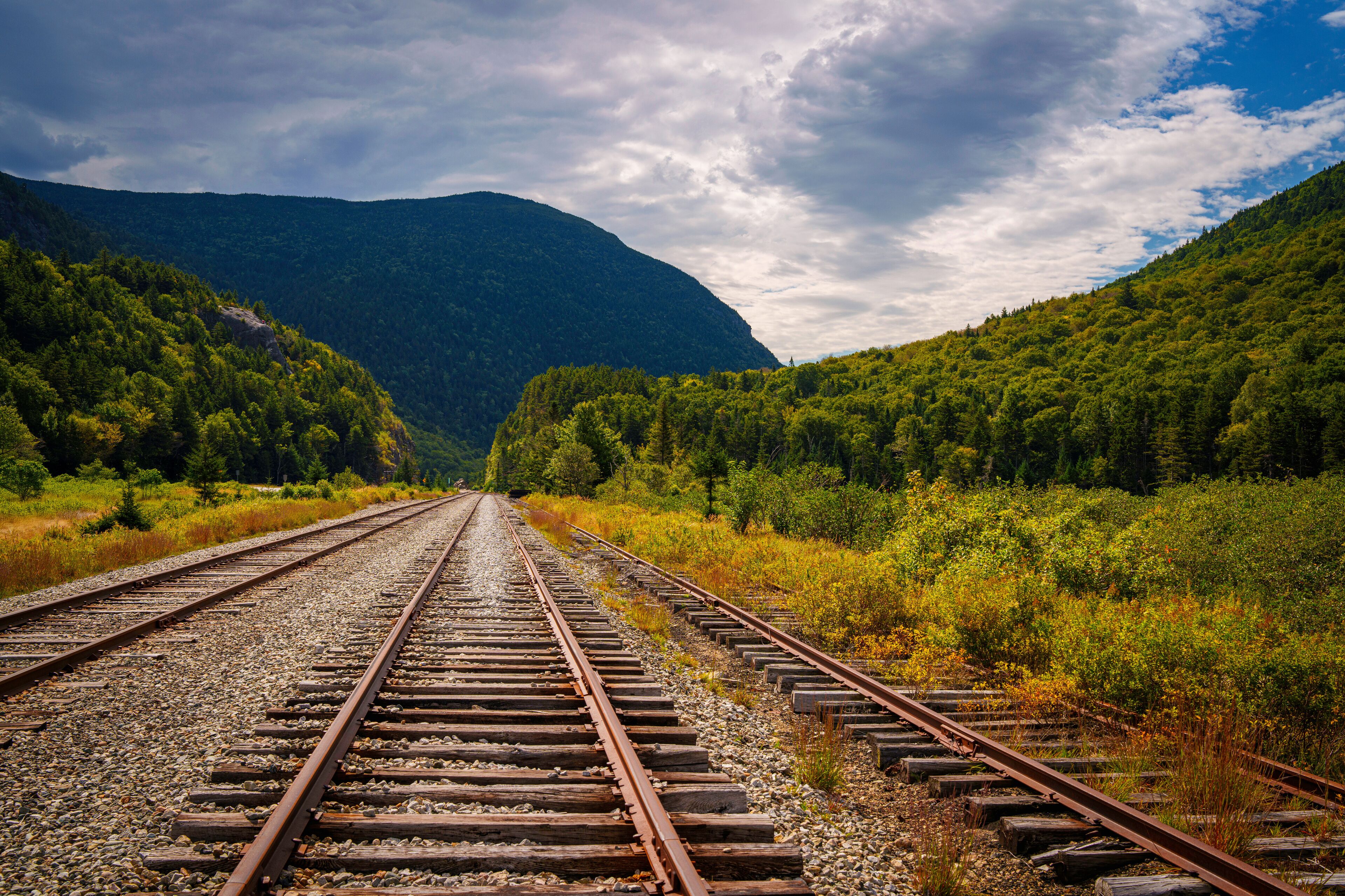 Scenic railroad tracks at Crawford Notch Depot running through White Mountain National Forest in Benton Woods and Carroll, New Hampshire, USA