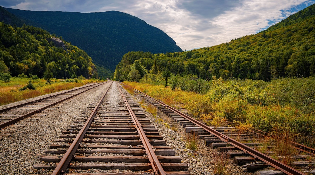 Scenic railroad tracks at Crawford Notch Depot running through White Mountain National Forest in Benton Woods and Carroll, New Hampshire, USA
