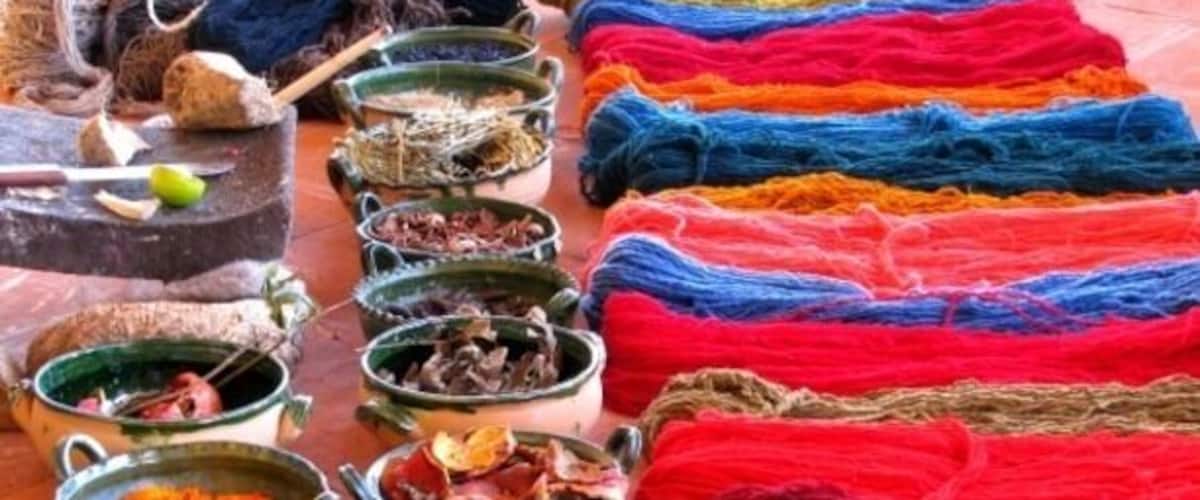 Various bowls of yarn in different colors and textures.