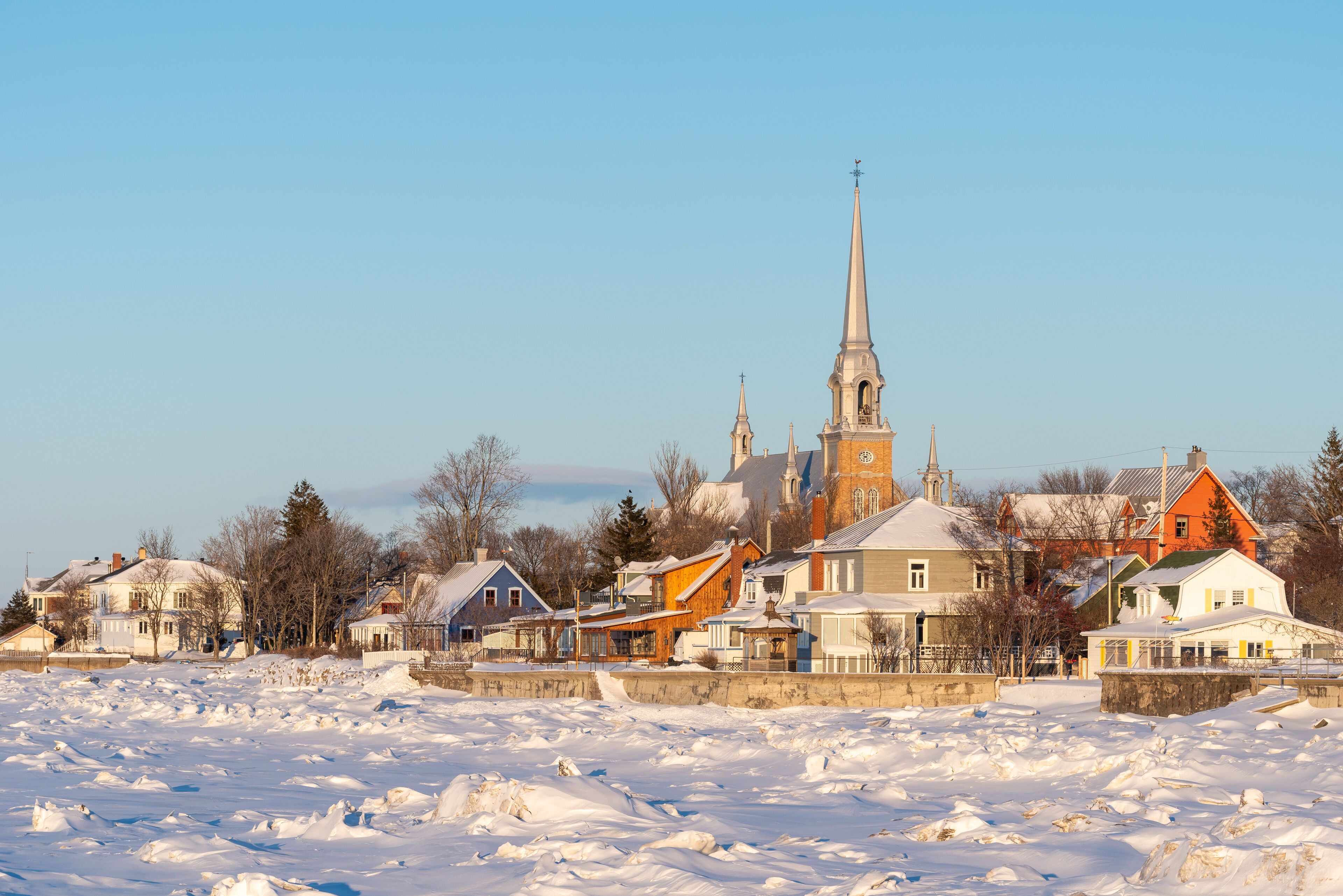 In winter, at the sunset, the town of Kamouraska see from the pier in the harbor (Bas-Saint-Laurent, Quebec, Canada)