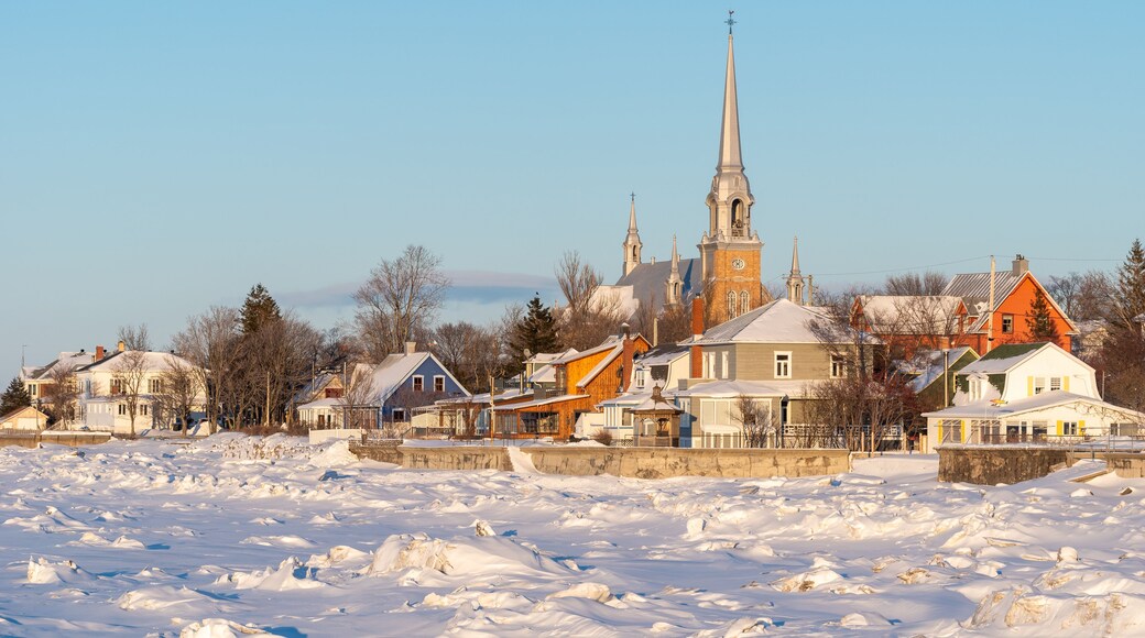 In winter, at the sunset, the town of Kamouraska see from the pier in the harbor (Bas-Saint-Laurent, Quebec, Canada)