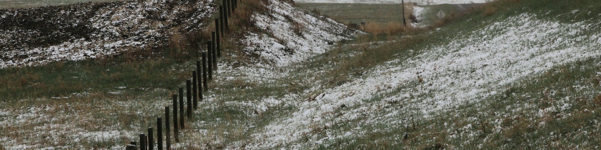 The last gasp of winter dusts the hills and fields near Black Diamond in Alberta.