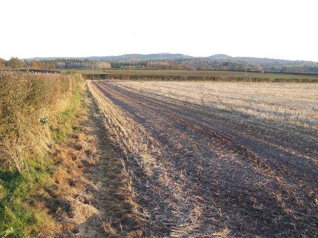View east of Wormbridge A stubble field still to be ploughed. In the distance is the distinctive outline of Orcop and Saddlebow Hills.