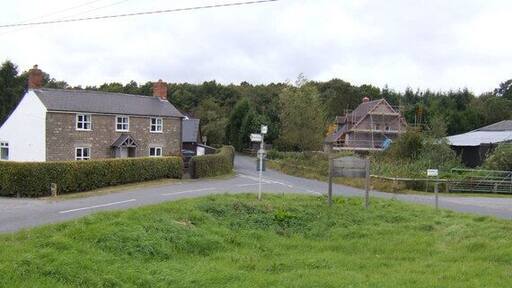 Old and new houses by Haugh Wood Viewed from the corner of Broadmoor Common. The wood is behind the cottages.
