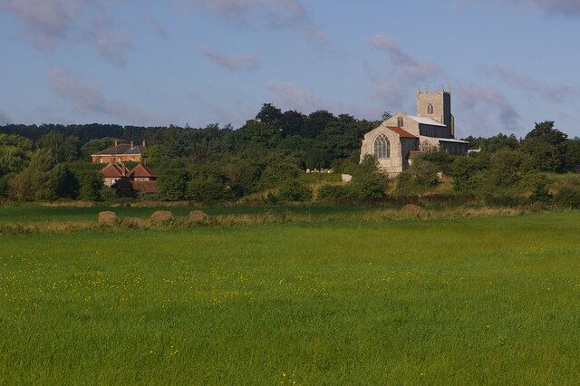 St Mary's Church, Wiveton Viewed across the River Glaven meadows from Glandford Road.