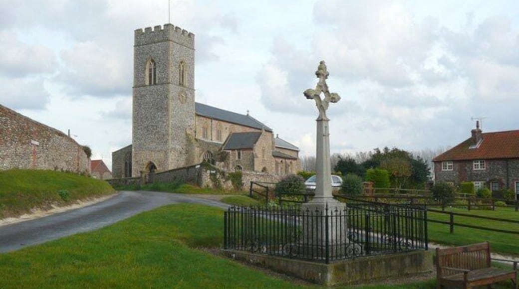 War memorial, High Street, Wighton A cross pierced by a diamond shape, and railed off which seems unusual for a quiet village, sited on a little triangular green.