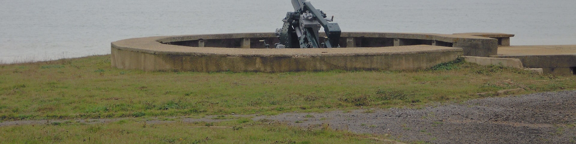 Photograph of the restored gun battery with a WW2 3.7 Inch Anti-Aircraft gun at the Muckleburgh Military Collection, Weybourne, Norfolk, UK.