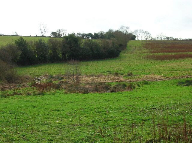 Footbridge near Westfield Carrying the footpath to Lankhurst Farm over an unnamed stream.