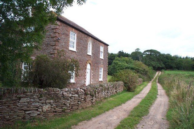 Burlinch, near West Monkton. This cottage is down a track which is also a public footpath. In the background is Burlinch Plantation.