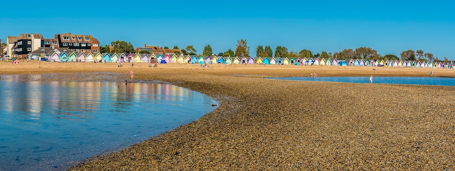 A wide-angle view from a sand bar towards the beach at West Mersea, UK in the summertime