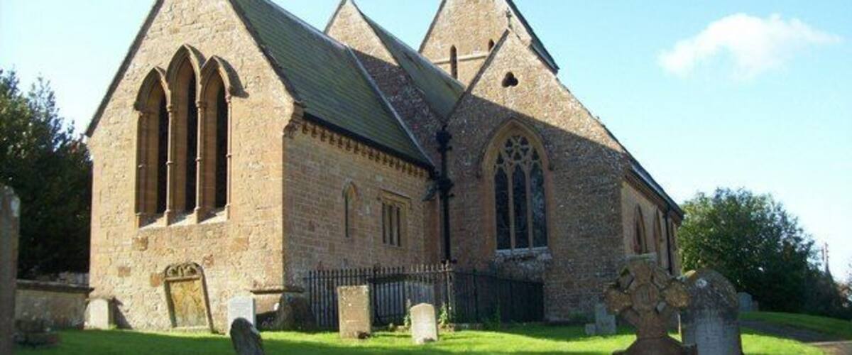 A stone church with pointed towers and arched windows.