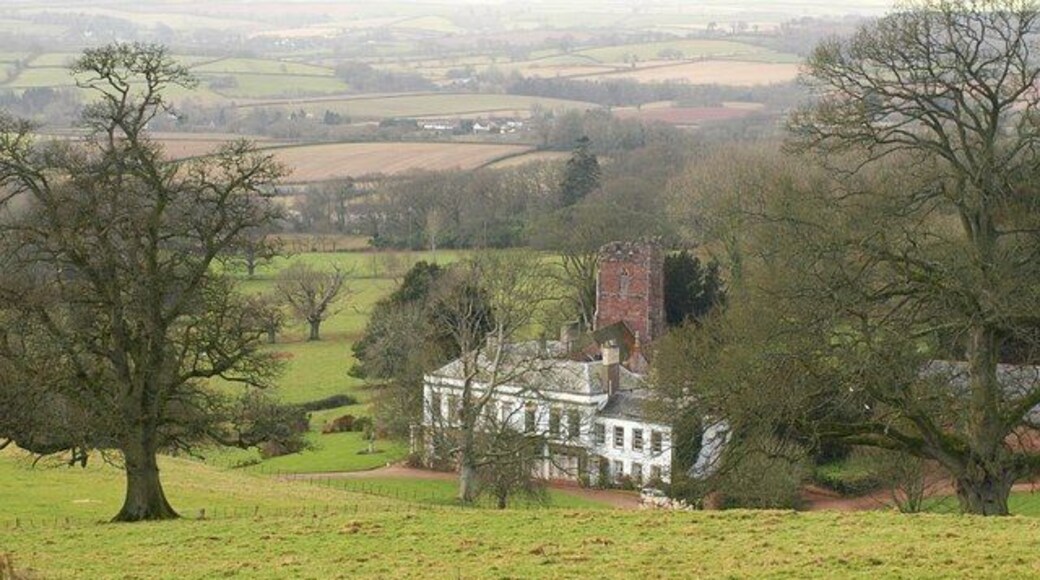 Bagborough House The house dates from about 1730, and was enlarged in the 1820s when the entrance was moved from the south side to this east side. Details at http://webapp1.somerset.gov.uk/her/details.asp?prn=40330 . Behind it is the C15 St. Pancras church, described at http://webapp1.somerset.gov.uk/her/details.asp?prn=40323 . Apart from the tower, "over-restored", says Pevsner (1958). Together they sit in an impressive landscaped park on the slopes of the Quantock Hills. Seen from Stout Lane.