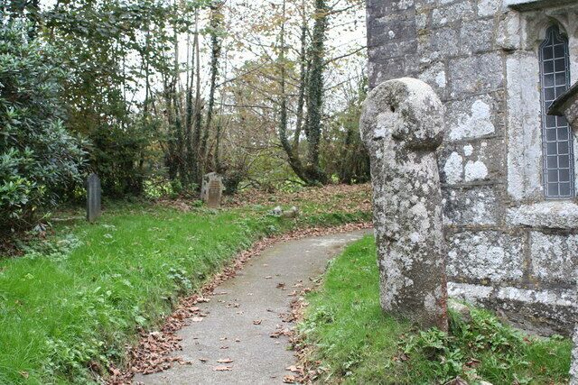 Ancient cross in Warleggan churchyard. Believed to date from the C8th, this cross is understood to have been moved to the churchyard in the 19th century from near Carburrow where it was thought to have been used to mark the path across the moor from Warleggan to Temple.