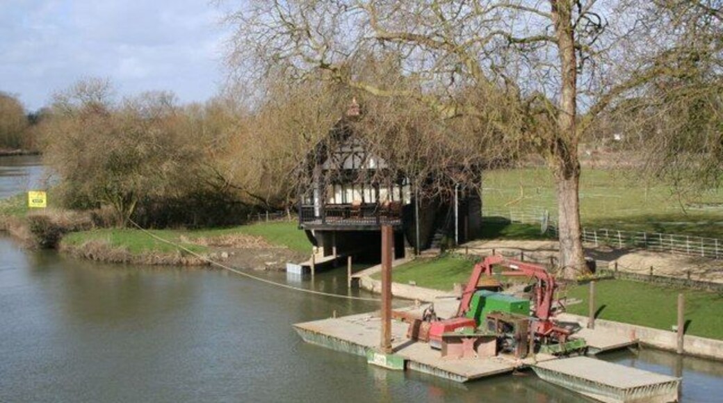 Boathouse by the Bridge The boathouse is probably Victorian and for many years was used as a boathouse. It was bought by someone and made into a dwelling and the boat mooring filled in. I see now that has been dug out again so boats can be moored. The big problem with living here is that it floods and the only way to get to it is by rowing a boat. I could not tell you what the barges are for in the foreground.