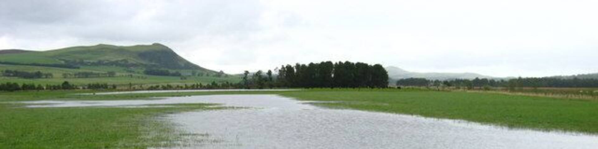 Flooded Field Flooded field by the South Medwin. The hill in the distance is Dunsyre Hill.