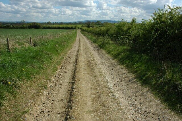 Track to the south of Cowsden Track and right of way to the south of Cowsden near Upton Snodsbury. Bredon Hill can be seen on the horizon.
