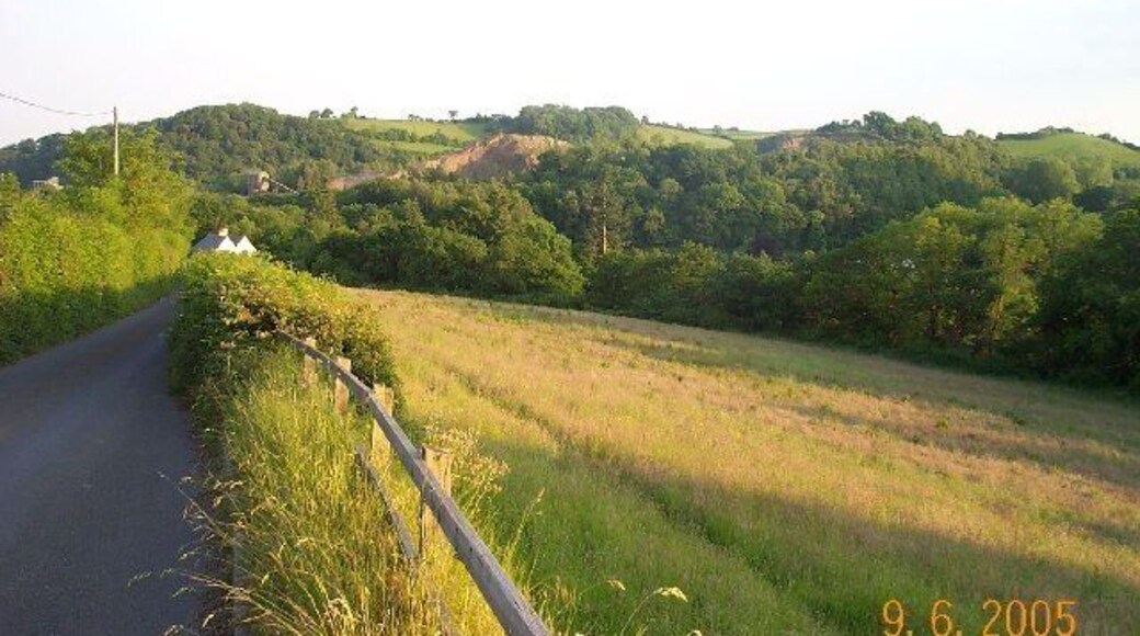 Trusham Quarry. There is a dolerite quarry here - well hidden by the trees. It has won awards for sensitive landscaping. The Teign river flows through the valley.