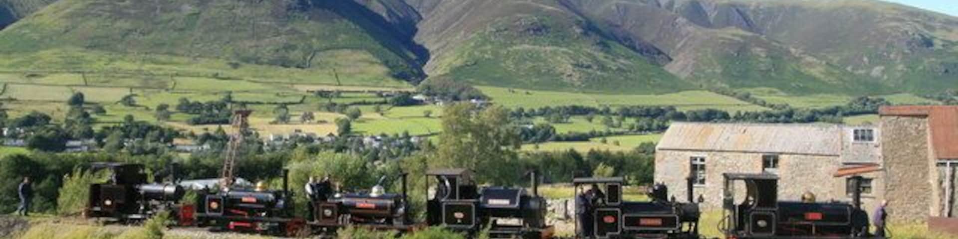 Threlkeld Quarry & Mining Museum - six visiting locomotives. The six visiting locomotives for the steam gala were all lined up in the sun at the end of the day. From left to right these are: Hudswell, Clarke No. 1238 of 1916. From Apedale Valley Light Railway. Sybil Mary - Hunslet 0-4-0ST No. 921 of 1906. From Statfold Barn Railway. Hugh Napier - Hunslet 0-4-0ST No. 855 0f 1904. From the Ffestinog Railway. Stanhope - Kerr Stuart 0-4-2ST narrow gauge locomotive of the Tattoo class. From the Apedale Valley Light Railway. Marchlyn - Avonside 0-6-0 No. 2067, 1933. From the Statfold Barn Railway. Lilla - Hunslet 0-4-0ST No. 554, 1891. From the Ffestiniog Railway.