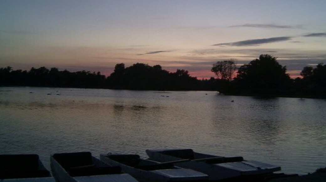 Sunset At Thorpeness Meare. An unusual feature about this mere is that punts are hires out as well as boats, seen in the foreground.