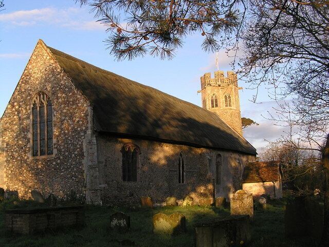 Theberton Church, near to Theberton, Suffolk, Great Britain. Early morning light cast shadows on the church. This picture is viewed from a corner that allows access to the village hall.
