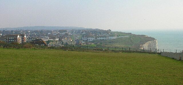 Telscombe Cliffs. Looking east from the footpath along the clifftop. The area was developed from the first decade of the twentieth century onwards on land leased by Ambrose Gorham, then the major landowner in Telscombe. The cream buildings in the centre of the picture are now the Badger's Watch pub. Prior to that they were early 19th century coastguard cottages and the only buildings to be found along this stretch of the cliffs before 1900.