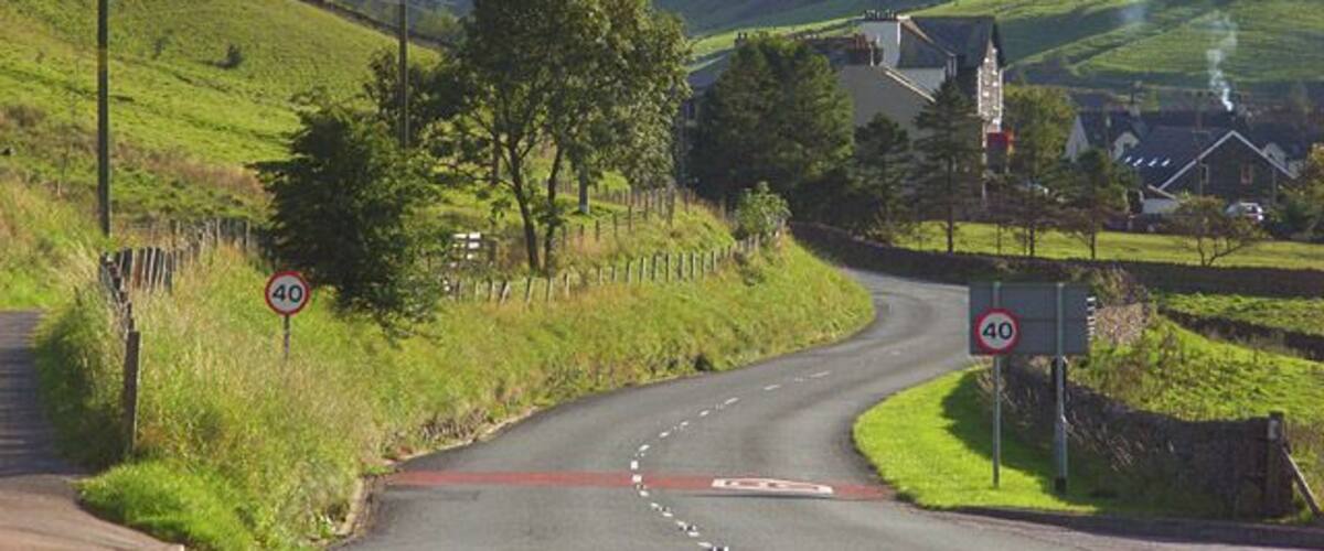 The A685, Tebay The road leaving the main part of the village as it makes its way towards Kendal. The buildings ahead are just above the site of the former railway station. The former Junction Hotel is prominent. The narrow valley is that of the River Lune. It separates the Howgill Fells to the left from the foothills of the Lake District to the right. As well as the road, the M6 and the West Coast Mainline run through this gap in the hills.