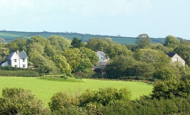 Castle Ely and Fronhaul There was once a medieval settlement here, now all that remains is these houses and a farm. The tumulus can be seen in the centre of the picture.