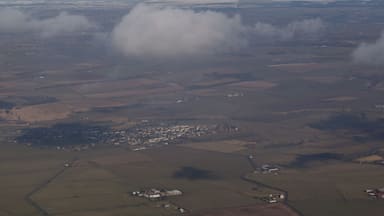 Tarbolton from the air Viewed from a Ryanair flight which has just taken off from Prestwick Airport. The farm in the centre foreground is West Carngillan.