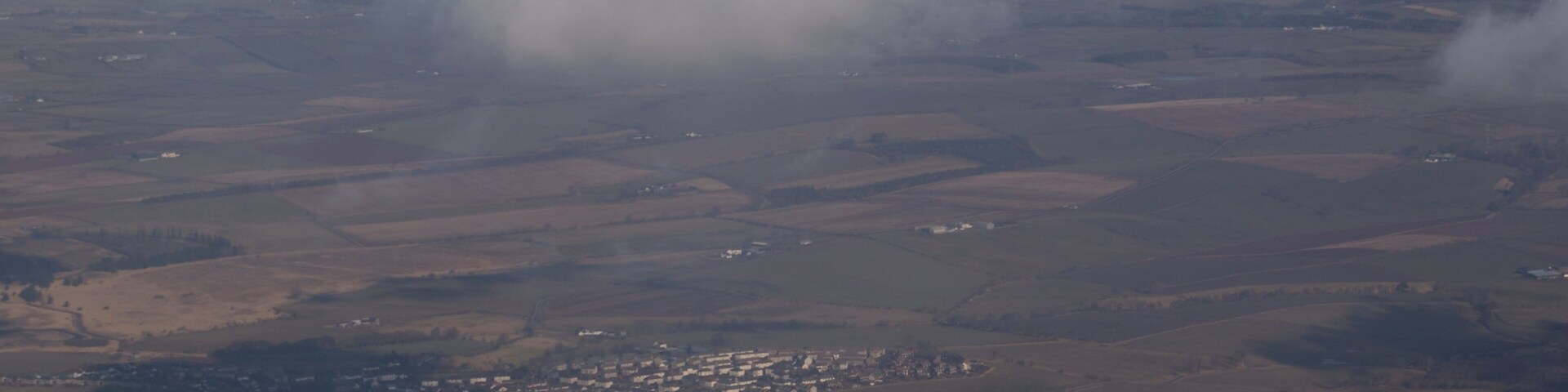 Tarbolton from the air Viewed from a Ryanair flight which has just taken off from Prestwick Airport. The farm in the centre foreground is West Carngillan.